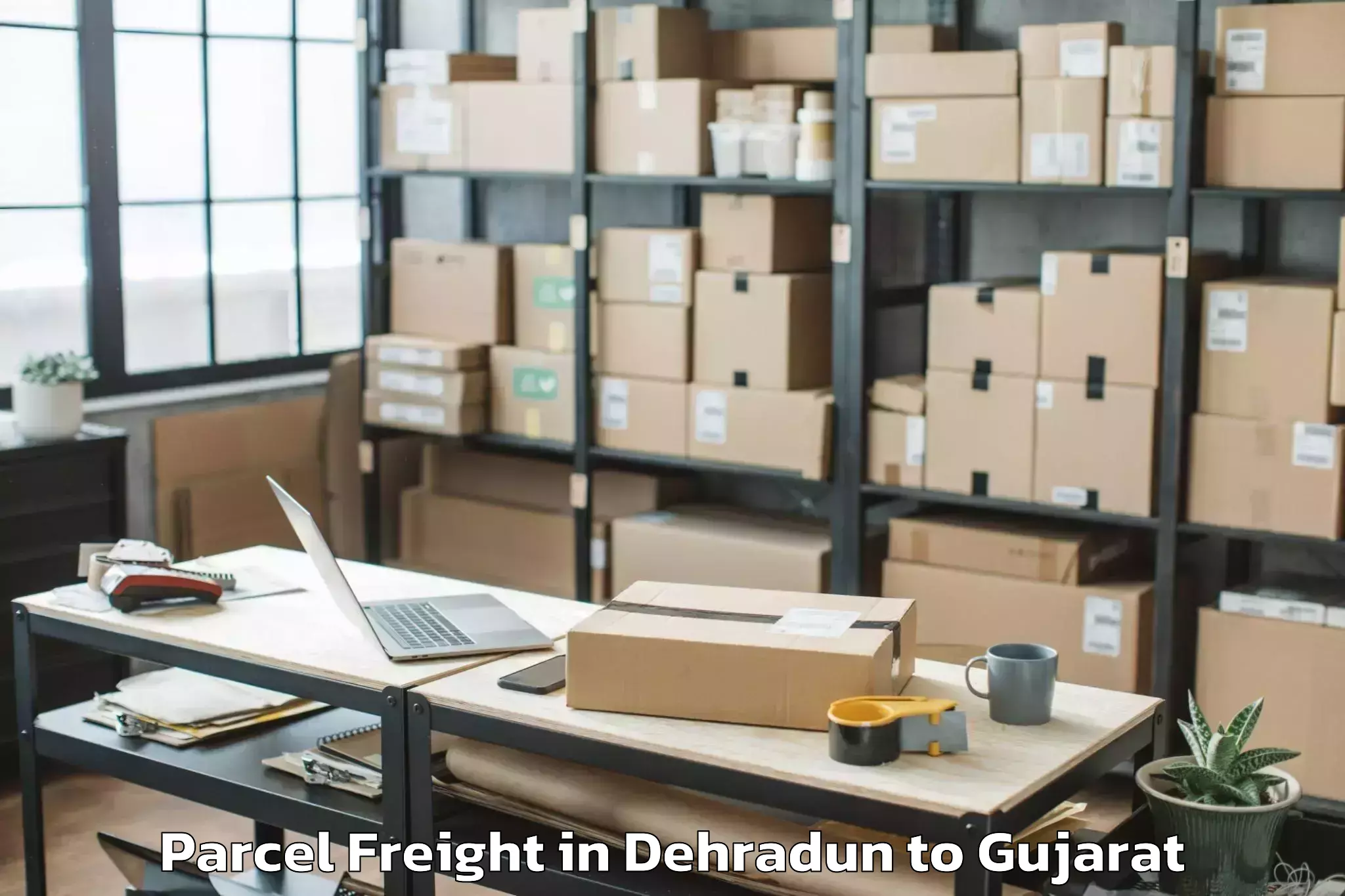 Easy Dehradun to Nadiad Parcel Freight Booking